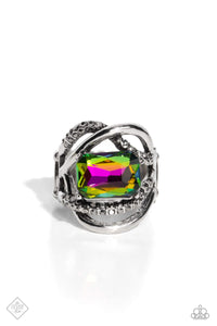 <p>A pair of sleek silver bands — one dotted in hematite rhinestones — orbit around a radiant-cut, oil spill gem, for an edgy, three-dimensional centerpiece atop the finger. Features a stretchy band for a flexible fit. Due to its prismatic palette, color may vary.</p> <p>&nbsp;</p>