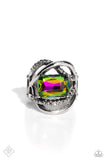 <p>A pair of sleek silver bands — one dotted in hematite rhinestones — orbit around a radiant-cut, oil spill gem, for an edgy, three-dimensional centerpiece atop the finger. Features a stretchy band for a flexible fit. Due to its prismatic palette, color may vary.</p> <p>&nbsp;</p>