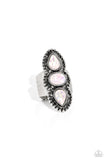 Centered around an elongated, decoratively studded silver frame, two opalescent refracted shimmer teardrops flank an opalescent oval, creating a whimsically seasonal statement piece atop the finger. Features a stretchy band for a flexible fit. Due to its prismatic palette, color may vary.