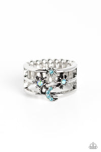Featuring blue and iridescent rhinestones, three-dimensional stars, and a crescent moon dot across three sleek silver bands that meet in the center of the finger, creating a sparkling out-of-this-world centerpiece. Features a stretchy band for a flexible fit. Due to its prismatic palette, color may vary.