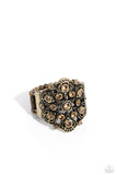 Sporadically dotted on a whimsically, intricate brass frame, light colored topaz rhinestones seemingly form into a delicate flower atop the finger for a refined centerpiece. Features a stretchy band for a flexible fit.