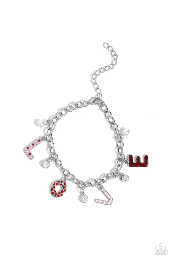 Dangling along a silver link chain, silver letters with various Valentine's-inspired details spell out the word 